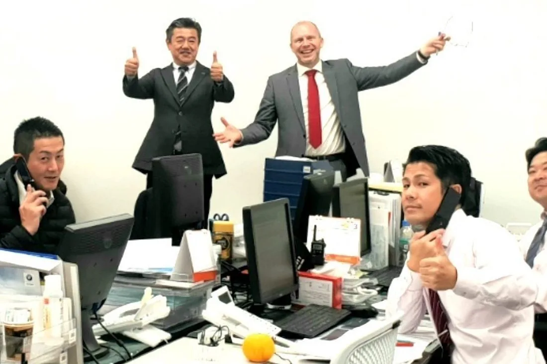 A client sales team on the phones after a session