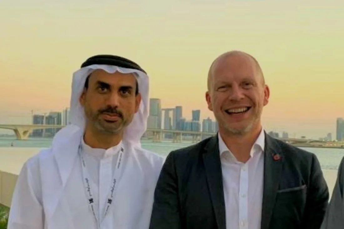 Jason with a colleague at a conference in Abu Dhabi